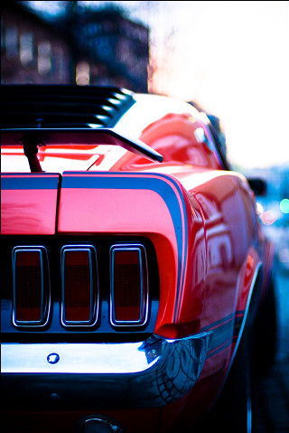 Red sports car parked side - the side of the road free wallpaper for mobile