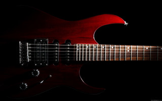 Red guitar black background guitar - against a black background free wallpaper