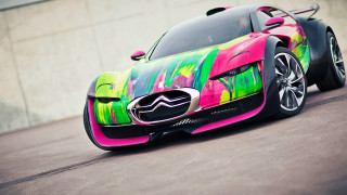 Colorful car parked street concrete - a concrete wall behind free wallpaper