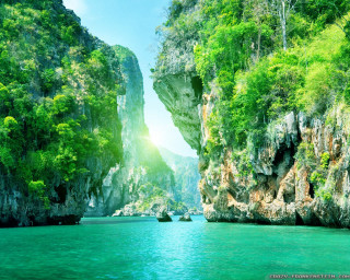 Beautiful view water mountain boat - a mountain in the background and a boat free wallpaper