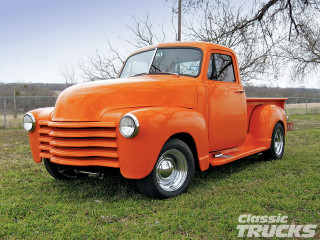 Orange truck parked field grass - area free wallpaper