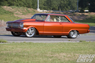 Orange car street grass trees - an orange car free wallpaper