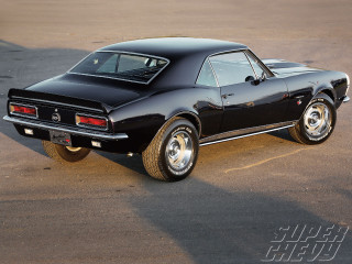 Black muscle car parking lot - a black muscle car free wallpaper