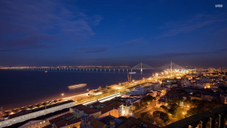 City night bridge water background - a bridge in the distance free wallpaper for desktop