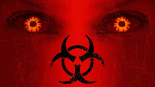 Red background biohazard sign glowing - yellow eye free wallpaper
