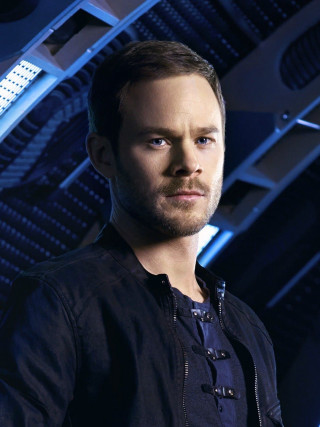 Man black shirt jacket blue - a character portrait free wallpaper