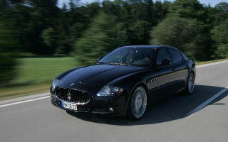 Black car driving road forest 8 - bernardo cavallino free wallpaper