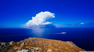 Boat water rocky shore cloud - constantine andreou free wallpaper