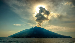 Volcano smoke water boat foreground - cagnaccio di san pietro free wallpaper