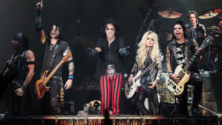 People stage guitars microphone performance - one person holding free wallpaper for desktop