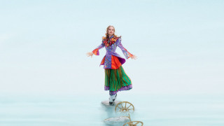 Woman colorful dress balancing wheel - a colorful dress free wallpaper