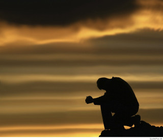 Silhouette man sitting rock sunset - a silhouette of a man free wallpaper