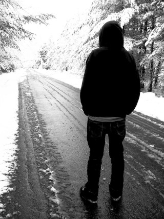 Person standing snowy road woods - winter free wallpaper for mobile
