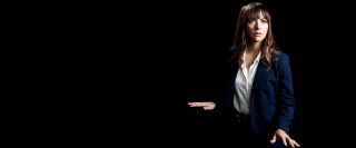 Woman suit serious hands out - a woman in a suit free wallpaper