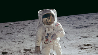 Astronaut walking on moon space - free space wallpaper
