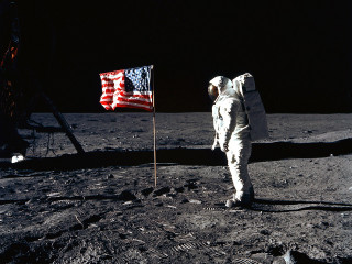 Astronaut standing moon flag surface - the moon next free wallpaper