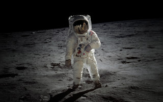 Astronaut moon dark sky flashlight - his hand and a helmet free wallpaper