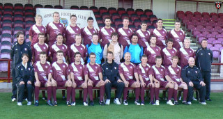 Soccer team photo bench stadium - a banner in the background free wallpaper