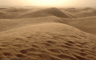 Desert sand dunes sun clouds - a few footprint free wallpaper