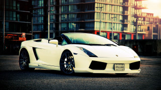 White sports car tall building - luxury free wallpaper