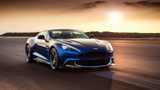 Blue sports car sunset road - a dark cloud in the sky free wallpaper