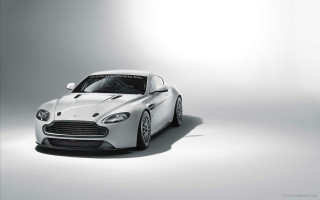 White sports car studio setting 2 - andrew bell free wallpaper