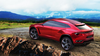 Red sports car rocky road - the mountain free wallpaper