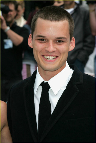 Young man smiling suit crowd - precisionism free wallpaper