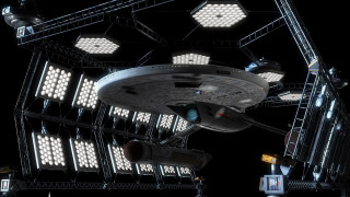 Large spaceship lit up military - a traffic light free wallpaper