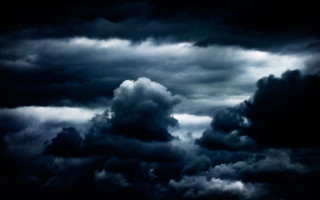 Dark sky plane distant clouds - a plane in the foreground free wallpaper for desktop