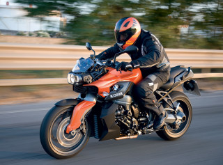 Motorcycle rider fence trees blurry - a fence and trees free wallpaper