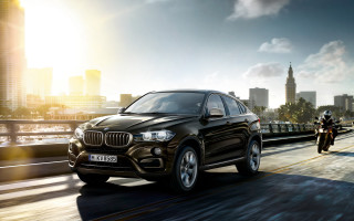 Black bmw suv city street - the side of the road free wallpaper