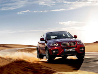 Red bmw suv desert road - a desert road free wallpaper