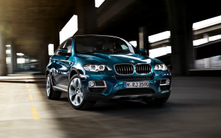 Blue bmw suv driving bridge 2 - a bridge and a building free wallpaper