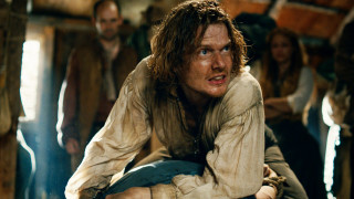 Man long hair beard sitting - a chair in a room free wallpaper