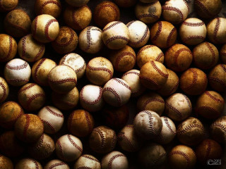 Baseballs pile tabletop black background - free sports wallpaper for desktop