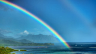 Rainbow water mountain boat scenery - a mountain in the background and a boat free wallpaper