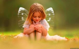 Little girl fairy wings sitting - a childs drawing free wallpaper
