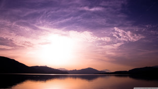 Sunset lake mountains clouds sky 2 - a beautiful sunset over a lake free wallpaper