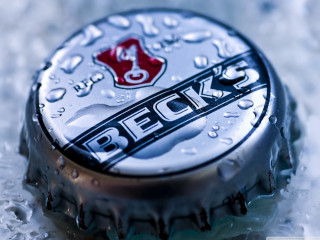 Bottle cap closeup water droplets - a table top free wallpaper