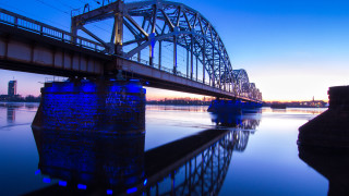 Bridge river boat building sunset - the water and a building in the background free wallpaper