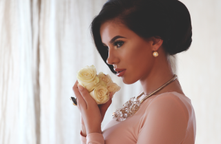 Woman holding flower necklace beautiful - her neck and a necklace free wallpaper