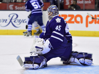 Hockey goalie sitting ice glove - his knee free wallpaper
