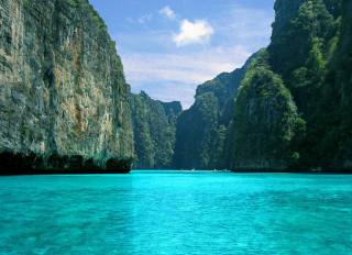 Boat water mountain range cliffs - a boat free wallpaper for desktop