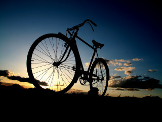 Bike parked grass sunset sun - the sun setting behind free wallpaper