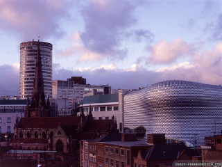 City skyline large buildings round - a large building in the background free wallpaper