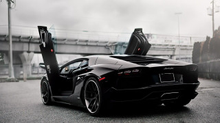 Black sports car parked side 2 - the door open free wallpaper