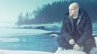 Bald man sitting rock snow - a bald man free wallpaper