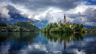 Castle island lake mountain clouds - a small island in the middle of a lake free wallpaper
