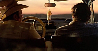 Two men sitting car steering - wheel free wallpaper